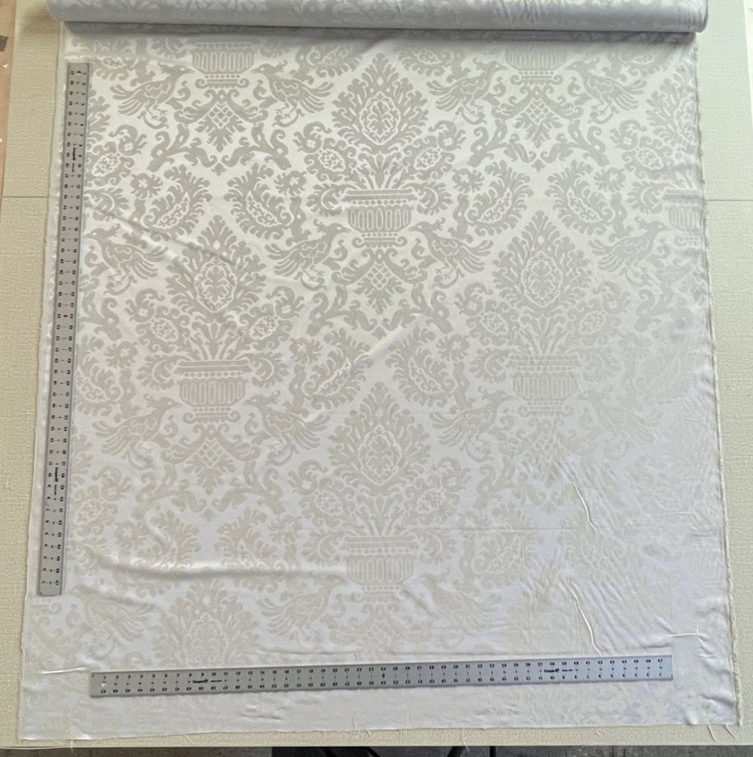 Damask converted to flame retardant polyester