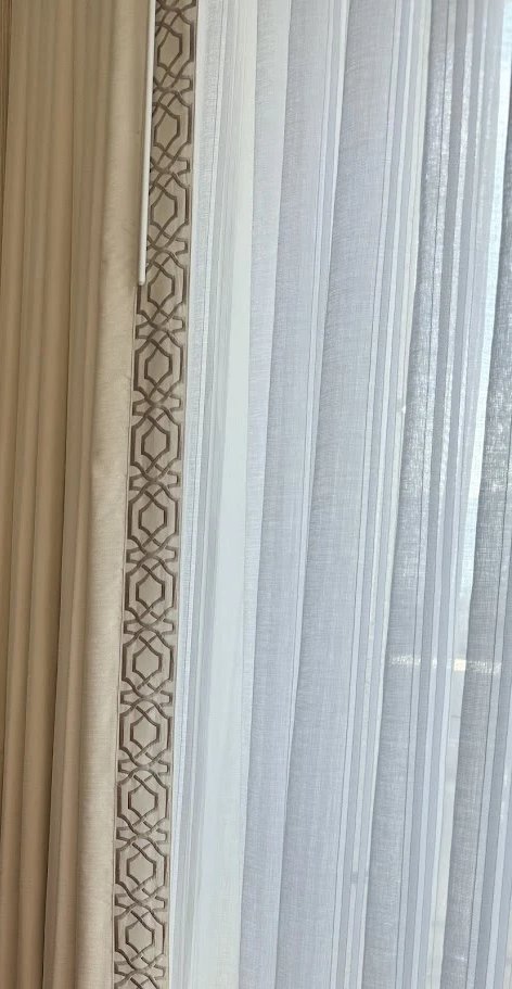 Embroidered tape on hotel drapery